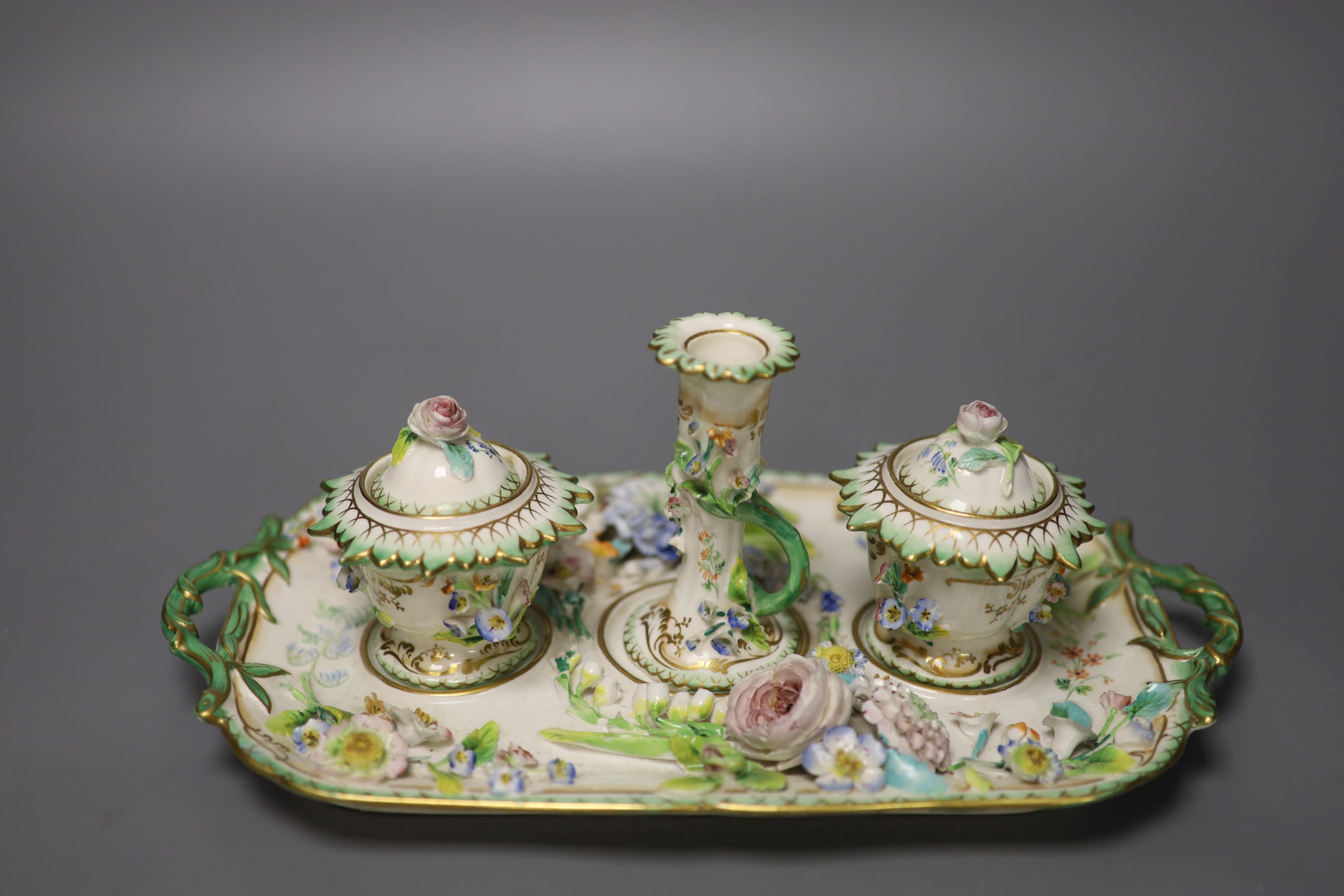 An English porcelain inkstand, of Coalbrookdale type painted and encrusted with flowers c.1830, length 27cm